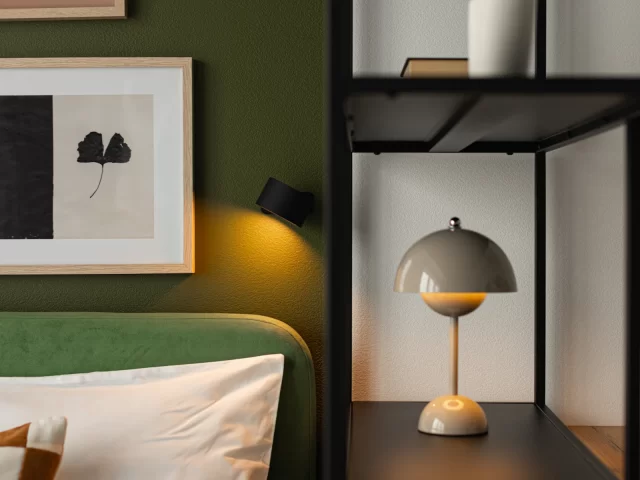 Phòng ngủ căn hộ hiện đại với đầu giường xanh lá và tranh treo