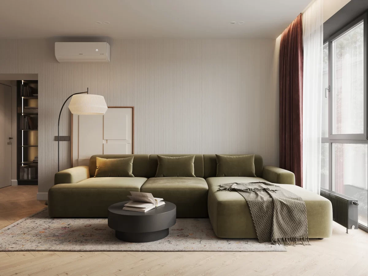 Phòng khách chung cư với ghế sofa lớn màu xanh lá nổi bật