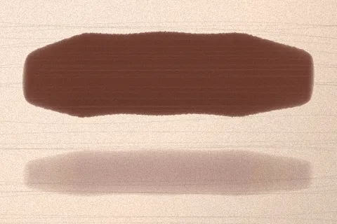 Swatch Son kem lì Ớt Cay màu Nâu Chocolate trên da rất sáng