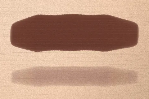 Swatch Son kem lì Ớt Cay màu Nâu Chocolate trên da sáng