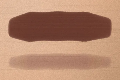 Swatch Son kem lì Ớt Cay màu Nâu Chocolate trên da trung bình sáng